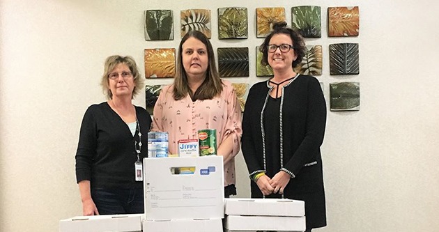 United Heartland employees participating in food drive for a community food bank.